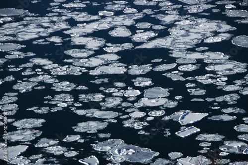 Panorama view of melted frozen glacier broken ice pieces floating on Eyjafjordur near Akureyri Northern Iceland Europe photo