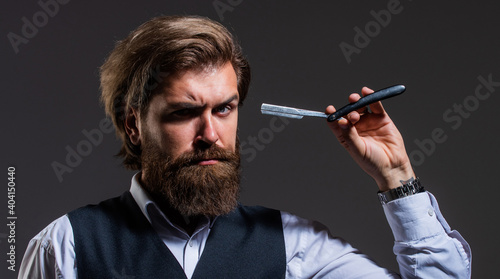 barber in hairdresser salon. hair tool. fashion and beauty. bearded man shaving beard. male grooming. mature businessman with razor blade. brutal hipster with moustache in barbershop