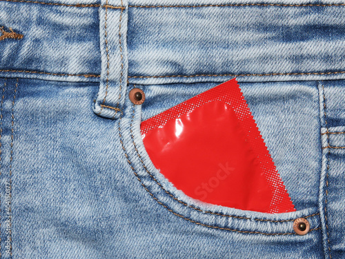 Condoms in package in jeans.