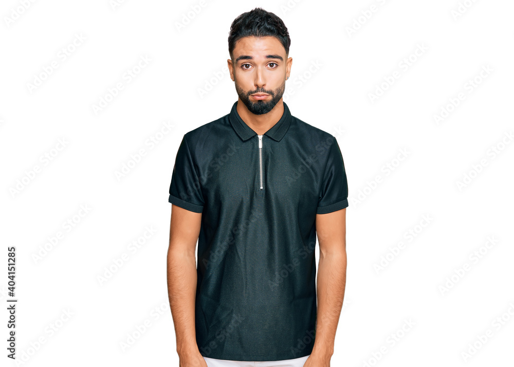Young man with beard wearing sportswear depressed and worry for distress, crying angry and afraid. sad expression. Young man with beard wearing sportswear depressed and worry for distress, crying angry and afraid. sad expression.