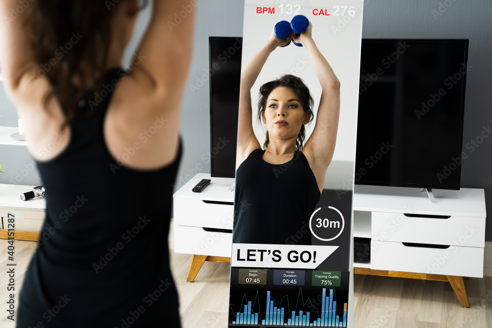 Fototapeta premium Fitness Exercise At Home Using Smart Mirror
