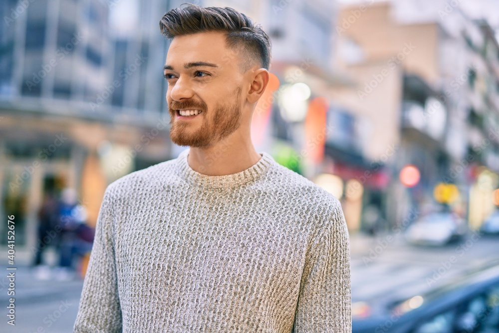 Young caucasian man smiling happy standing at the city. Young caucasian man smiling happy standing at the city.