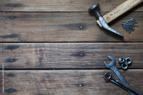 Old tools on the old workshop, wooden table, hummer, wrench and other