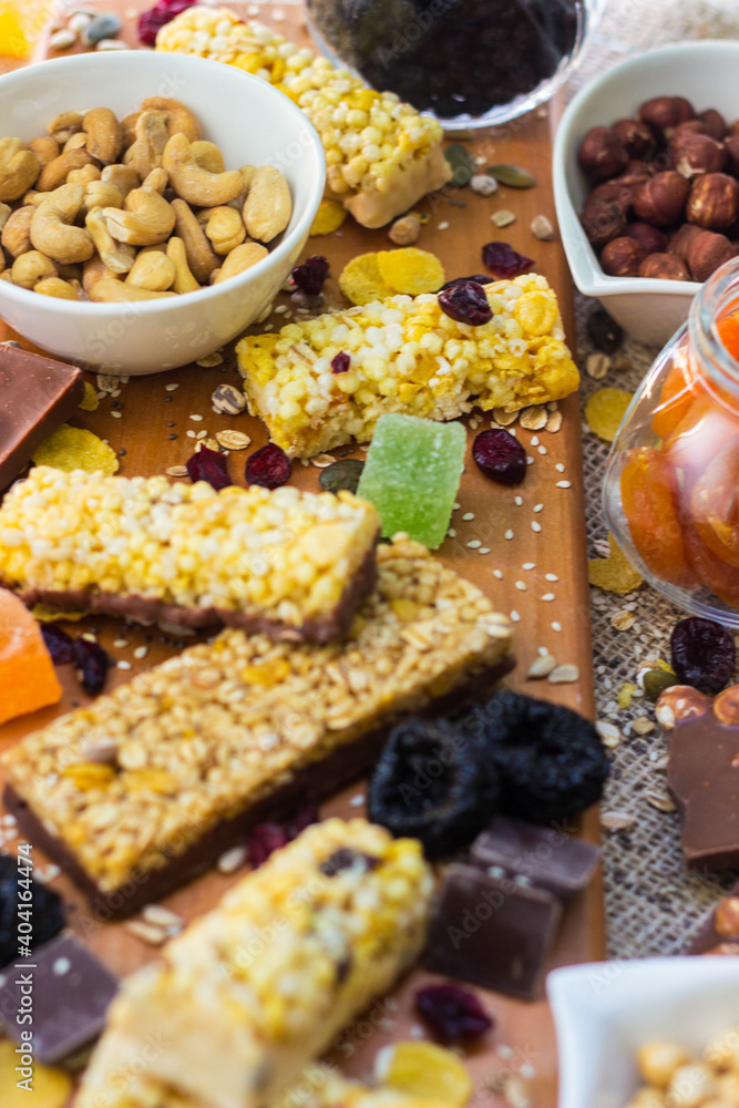 Granola Bars and mixed nuts. Honey bars with peanuts, chocolate, dried fruit, sesame and sunflower seeds Granola Bars and mixed nuts. Honey bars with peanuts, chocolate, dried fruit, sesame and sunflower seeds