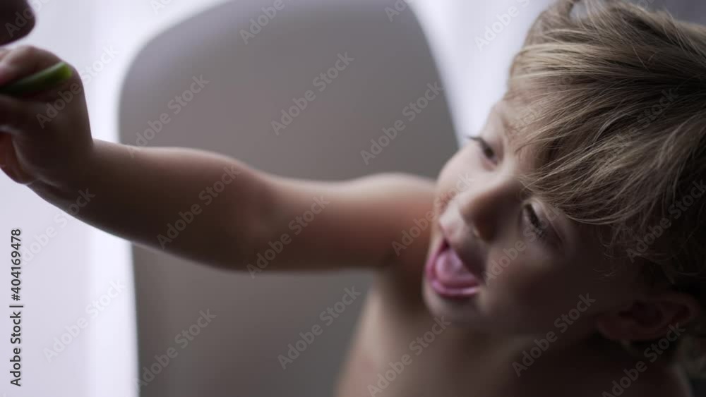 Child sharing food with mother, parent and toddler loving relationship Child sharing food with mother, parent and toddler loving relationship
