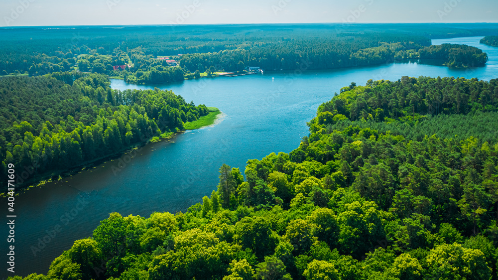 Big river between green forests in summer, Poland