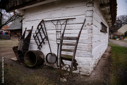 Backyard of traditional village farm house with roofed shed, historic country-style architecture in Skanzen, Polabi open-air ethnographic museum, Prerov nad Labem, Czech Republic photo