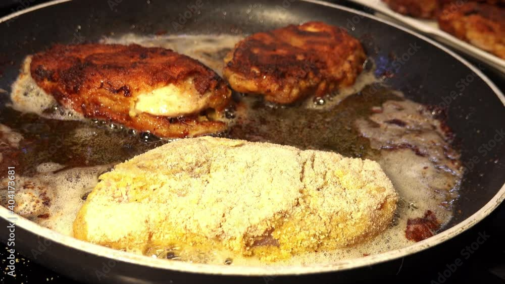 Meat Chops in Breadcrumbs Fried in Oil On PTFE Nonstick Frying Pan Closeup Isolated Meat Chops in Breadcrumbs Fried in Oil On PTFE Nonstick Frying Pan Closeup Isolated