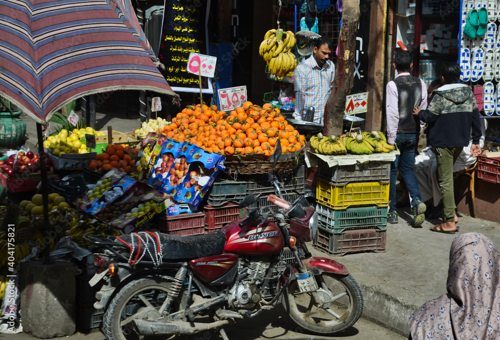 Egyptian Fruit Market with Crates and a Motorcycle