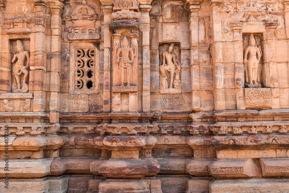 Ancient sculptures on iconic rock temples of Pattadakal, Karnataka, India.
