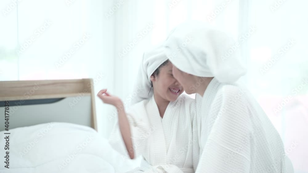 spa relaxation therapy at home, young Asian mother and her daughter enjoying with salon beauty or cosmetic spa, relax at home with family, motherhood concept spa relaxation therapy at home, young Asian mother and her daughter enjoying with salon beauty or cosmetic spa, relax at home with family, motherhood concept