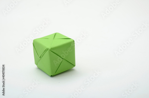green cubes with hand on white. white background