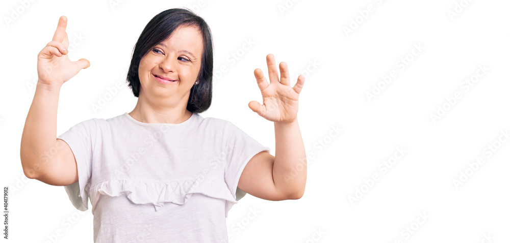 Brunette woman with down syndrome wearing casual white tshirt showing and pointing up with fingers number eight while smiling confident and happy. Brunette woman with down syndrome wearing casual white tshirt showing and pointing up with fingers number eight while smiling confident and happy.