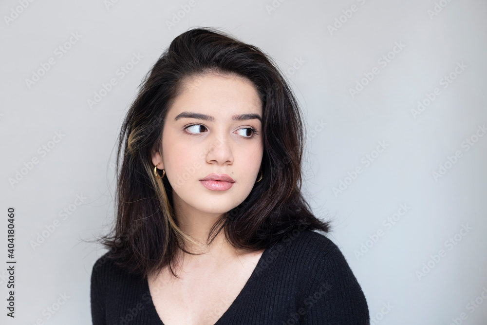 portrait of a beautiful girl on gray background portrait of a beautiful girl on gray background