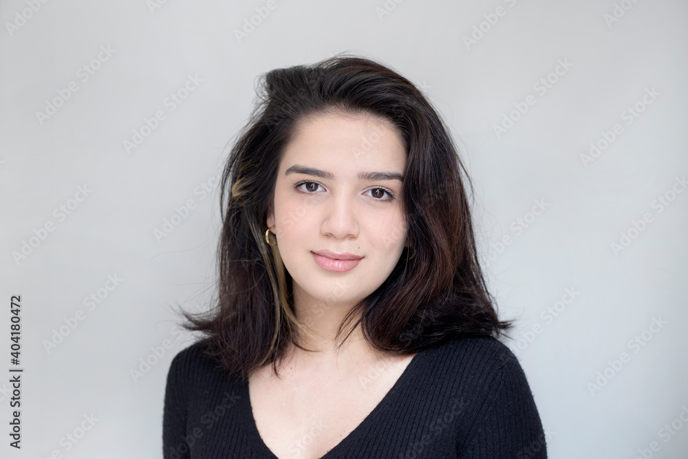 portrait of a beautiful girl on gray background portrait of a beautiful girl on gray background