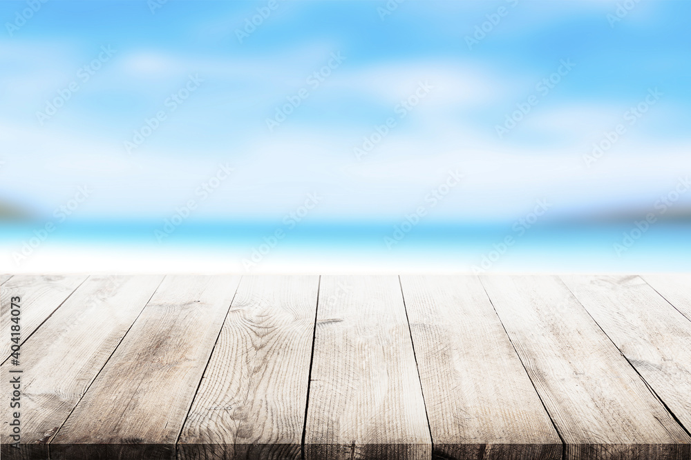 Empty wooden table, white sand on the beach and summer sky for editing or showing your products. Empty wooden table, white sand on the beach and summer sky for editing or showing your products.