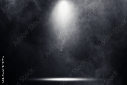 Empty space of Studio dark room with fog or mist and lighting effect.