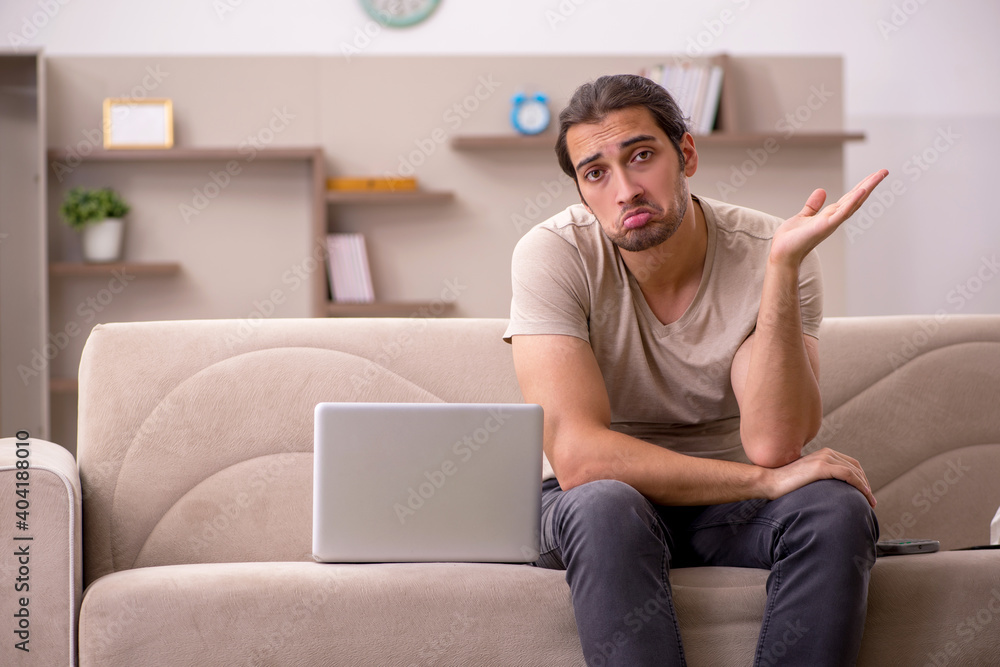 Young male freelancer working at home Young male freelancer working at home