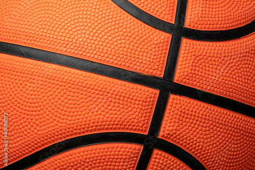 CLOSE UP DETAIL OF ORANGE BASKETBALL BALL TEXTURE. POINTS AND LINES.