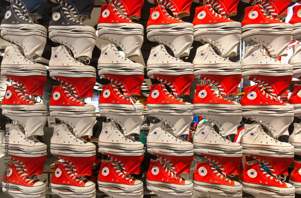 BEIJING, CHINA - MARCH 21, 2015: Dozens of Converse shoes are on display at  a store; Converse, an American shoe company founded in 1908, sells its  products worldwide through retailers Stock Photo | Adobe Stock