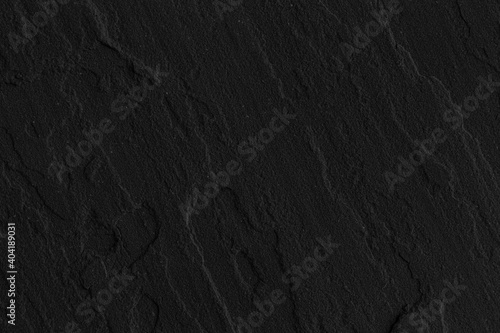 Dark grey black slate background or texture. Black granite slabs background