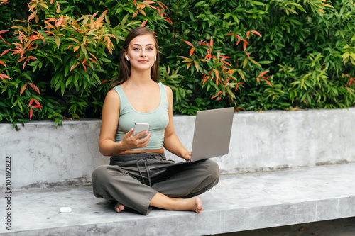 Принти на полотні Woman work freelance on laptop compute sitting at rocking chair in luxury villa