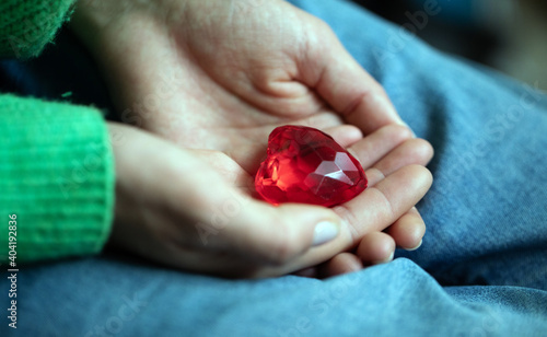 Woman hand holding red haert. Valentines day. Gifts. Photo. Idea. Famale. 