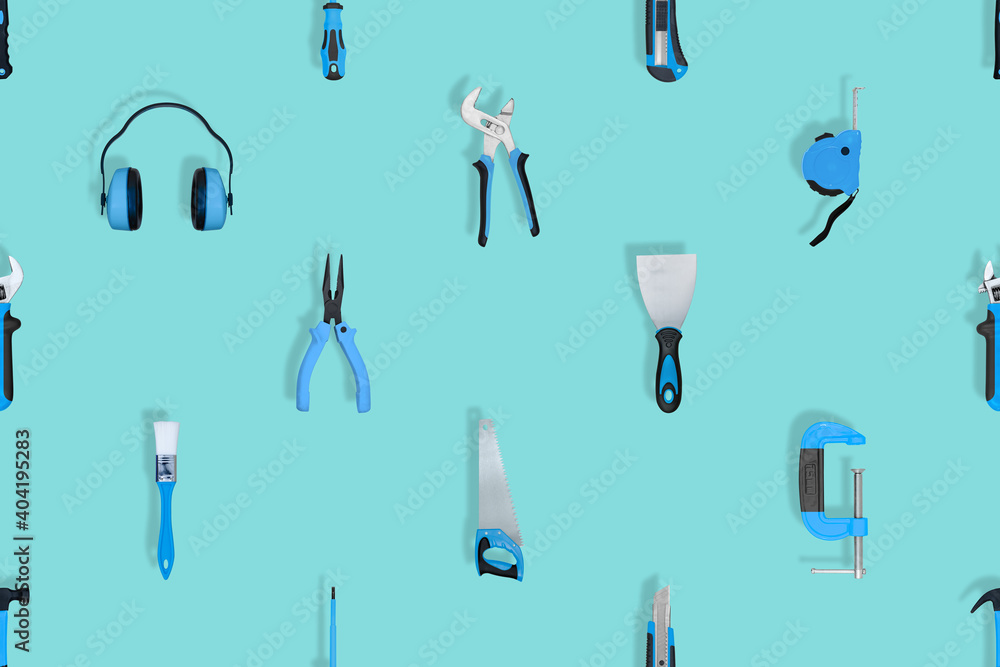 Tools seamless pattern. Various construction tools on an aquamarine background. Tools seamless pattern. Various construction tools on an aquamarine background.