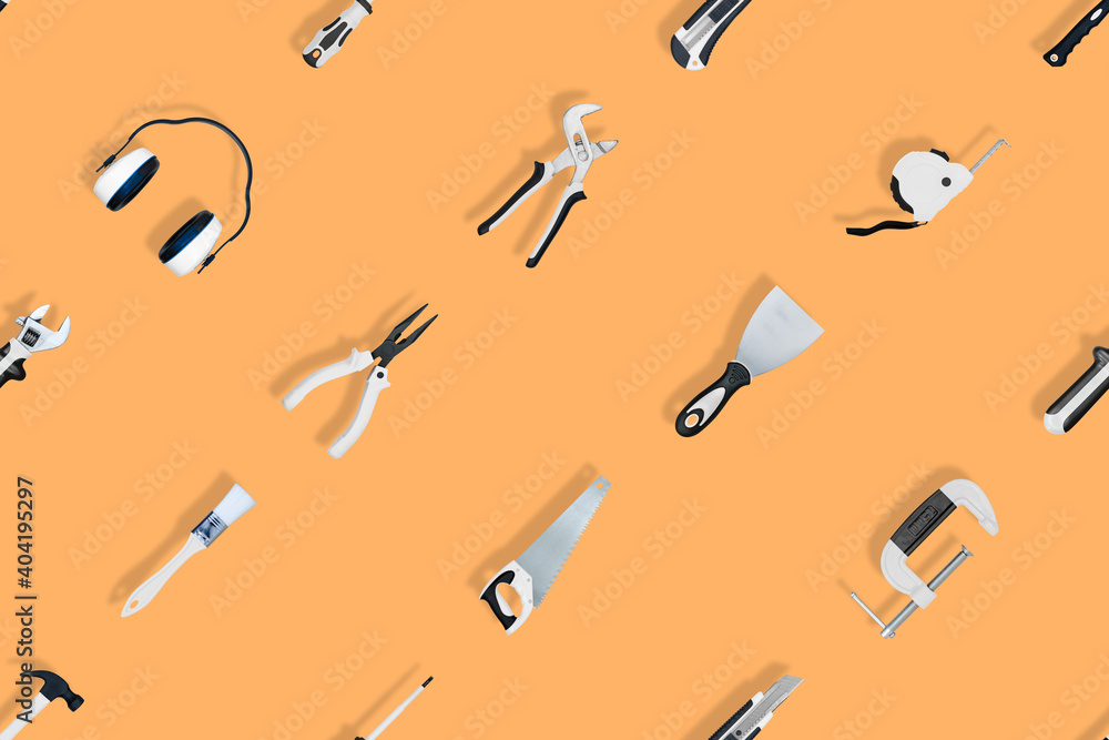 Tools seamless pattern. Various construction tools on an orange background. Tools seamless pattern. Various construction tools on an orange background.