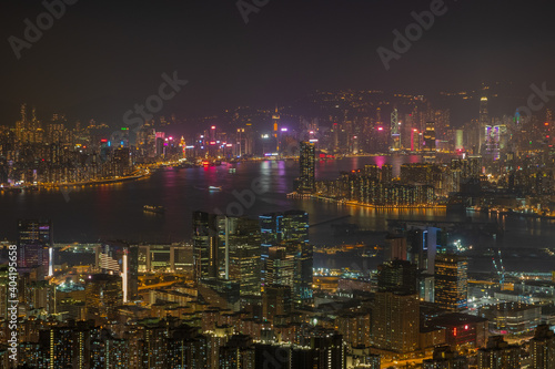 Victoria Harbour with Hong Kong Island and Kowloon visible in the distance from the top of Kowloon peak during the night hike