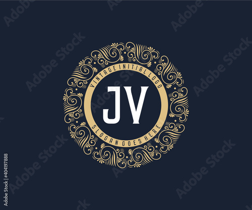 Initial JV Antique retro luxury victorian calligraphic emblem logo with ornamental frame. photo