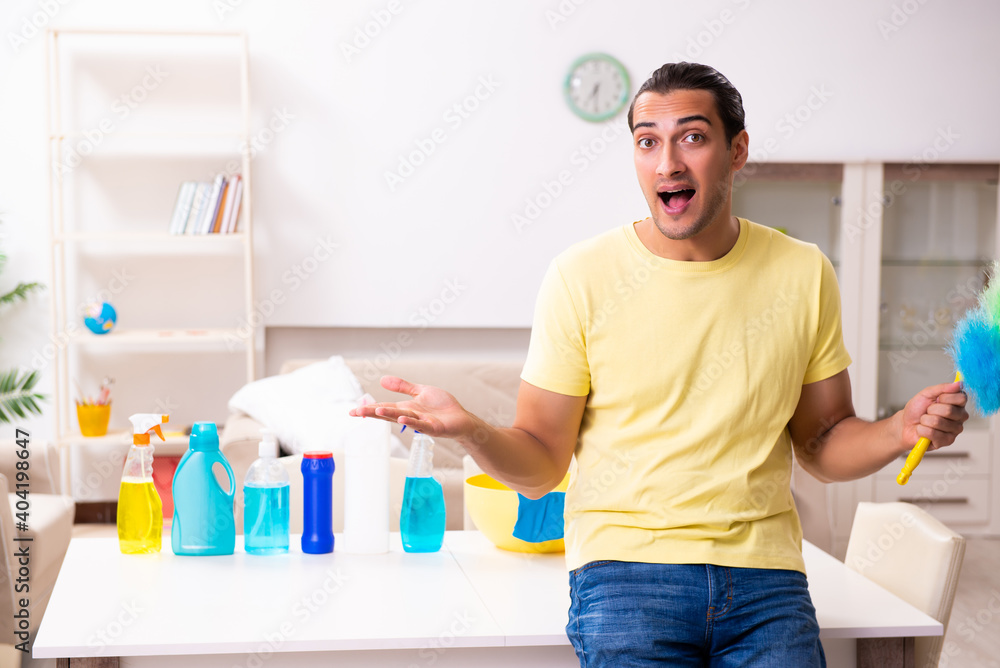 Young male contractor doing housework at home Young male contractor doing housework at home