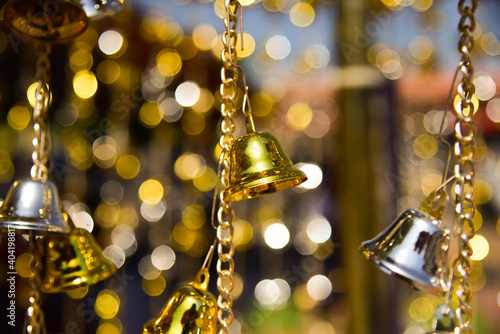 Gold bell on blur background. © toeytoey