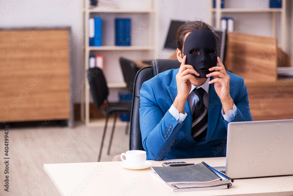Young male employee wearing masks in the office Young male employee wearing masks in the office