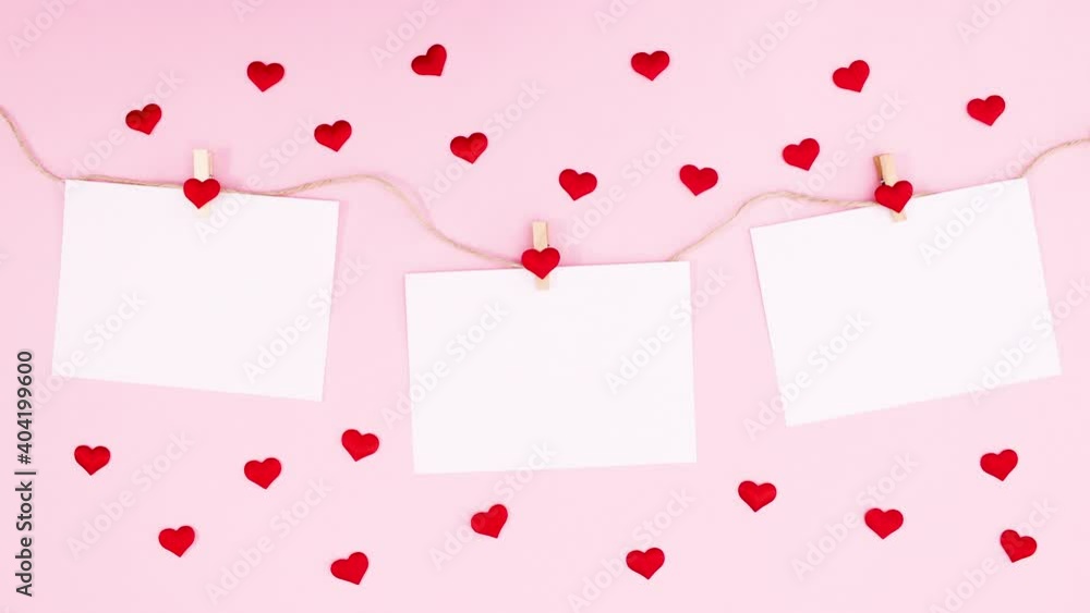 Hearts move around papers hooked on rope for valentine day. Stop motion