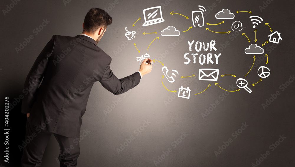 businessman drawing social media icons with YOUR STORY inscription, new media concept businessman drawing social media icons with YOUR STORY inscription, new media concept