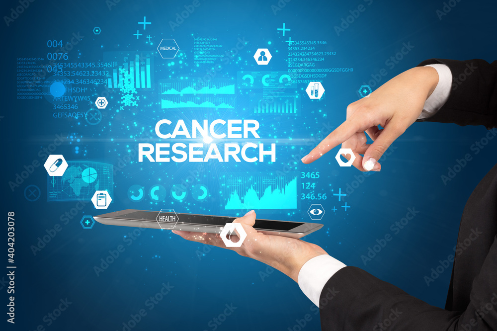 Obraz premium Close-up of a touchscreen with CANCER RESEARCH inscription, medical concept