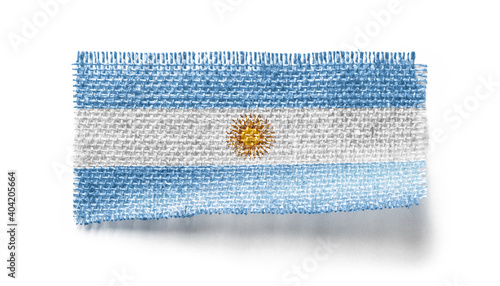 Argentina flag on a piece of cloth on a white background