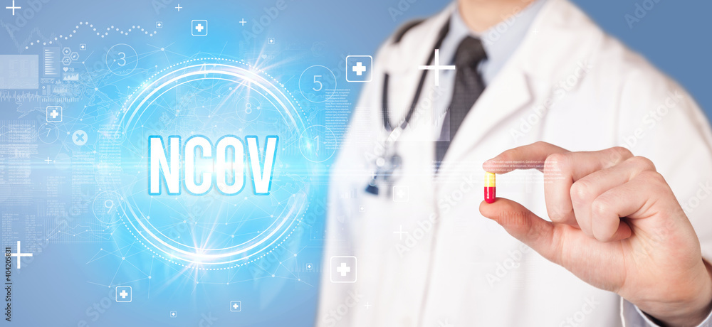 Close-up of a doctor giving you a pill with nCOV abbreviation, virology concept Close-up of a doctor giving you a pill with nCOV abbreviation, virology concept