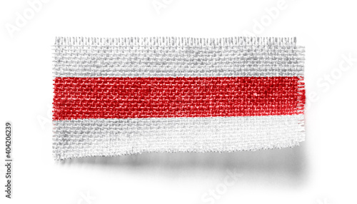 Belarus flag on a piece of cloth on a white background