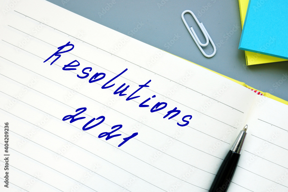 Financial concept meaning Resolutions 2021 with sign on the page.