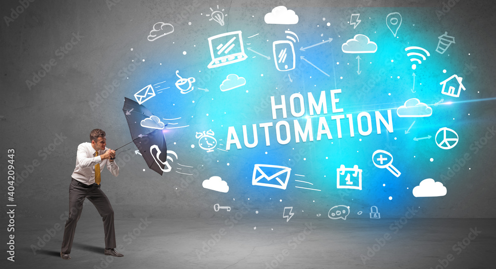 Businessman defending with umbrella from HOME AUTOMATION inscription, modern technology concept Businessman defending with umbrella from HOME AUTOMATION inscription, modern technology concept
