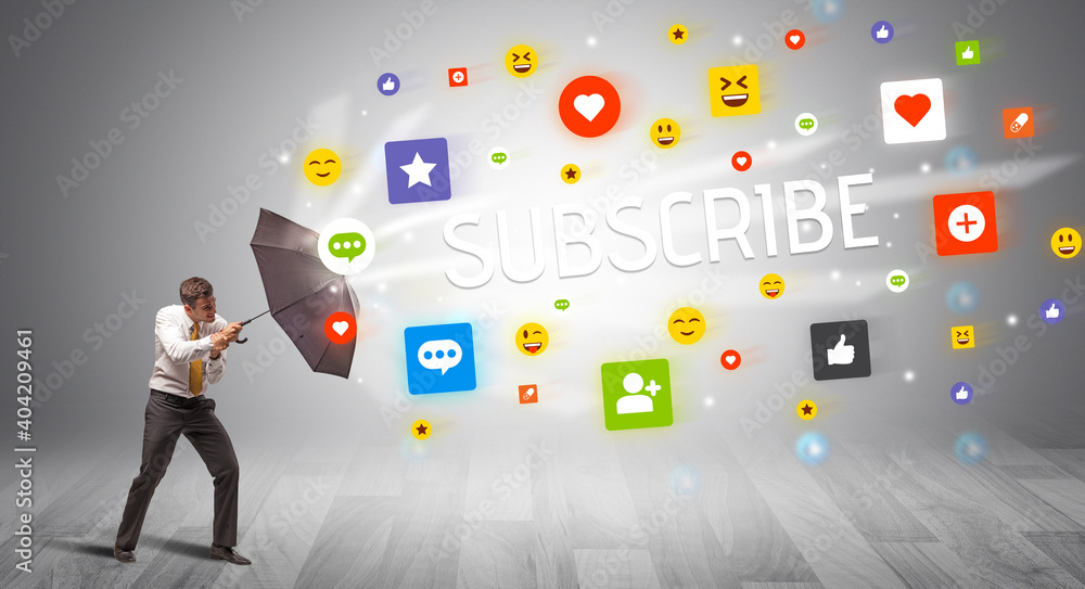 Handsome businessman defending with umbrella from SUBSCRIBE inscription, social networking concept Handsome businessman defending with umbrella from SUBSCRIBE inscription, social networking concept