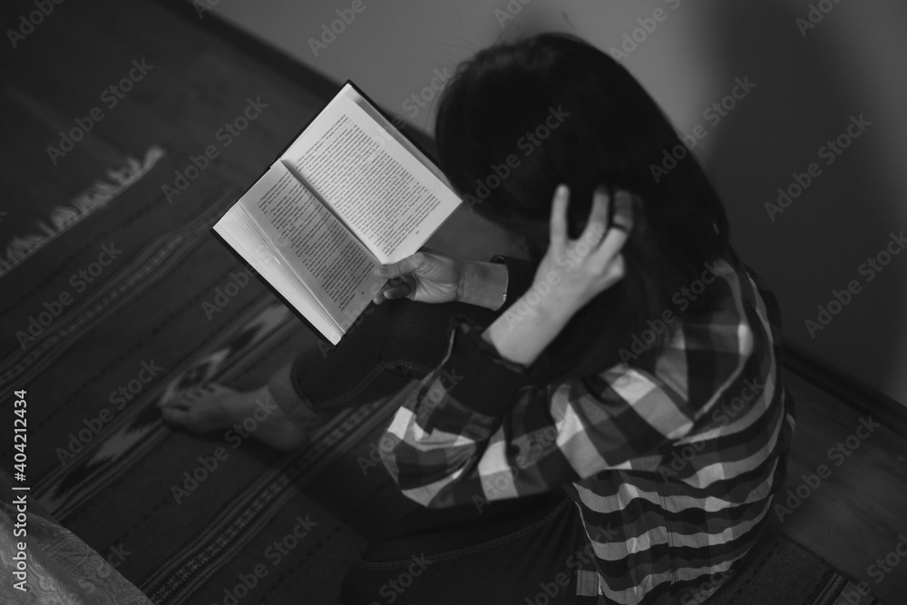 Fototapeta premium person reading a book