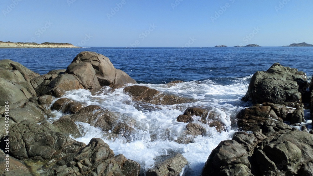 Waves on the rocks. Sardinia.