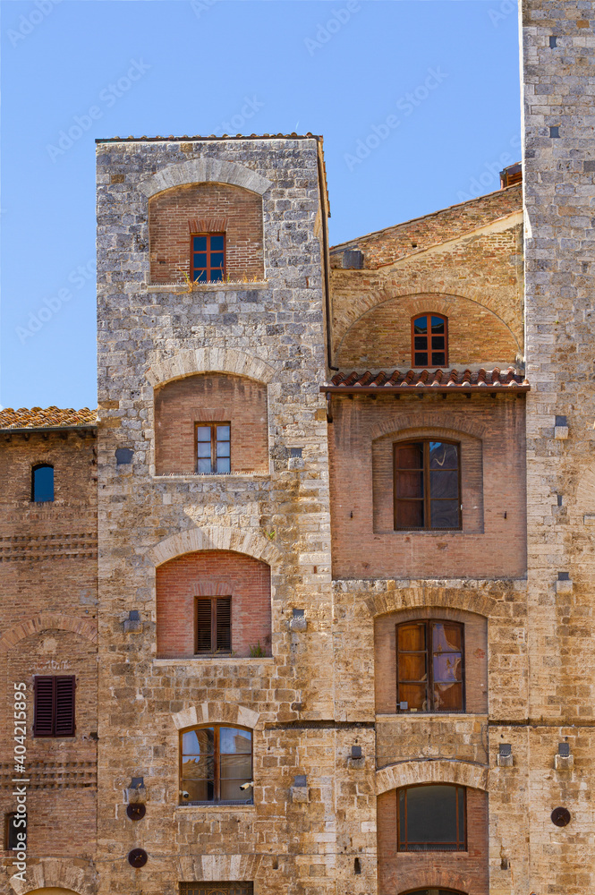 Facade of the medieval building in San Gimignano Tuscany, Italy