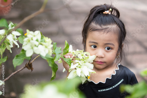 Photography portrait of a little girl with flowers