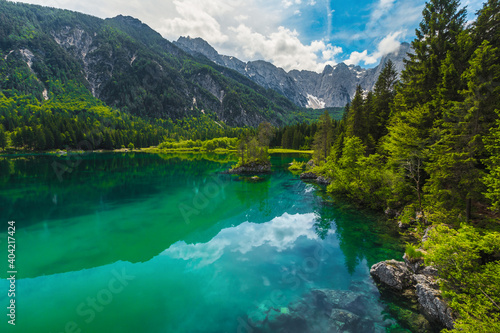 Spectacular lake Fusine with green forest and high mountains  Italy