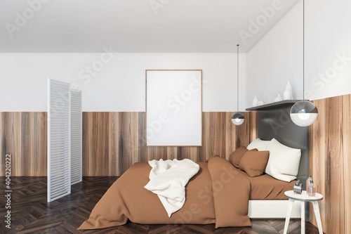 Mockup canvas in bedroom with brown bed, white screen and parquet floor