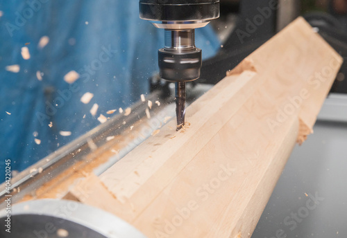 milling machine with Computer numerical control processes wood blank at high speed